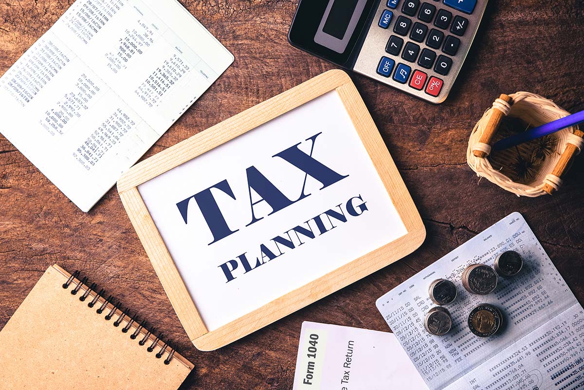 Tax planning and preparation supplies, with a board reading "Tax Planning" at the center